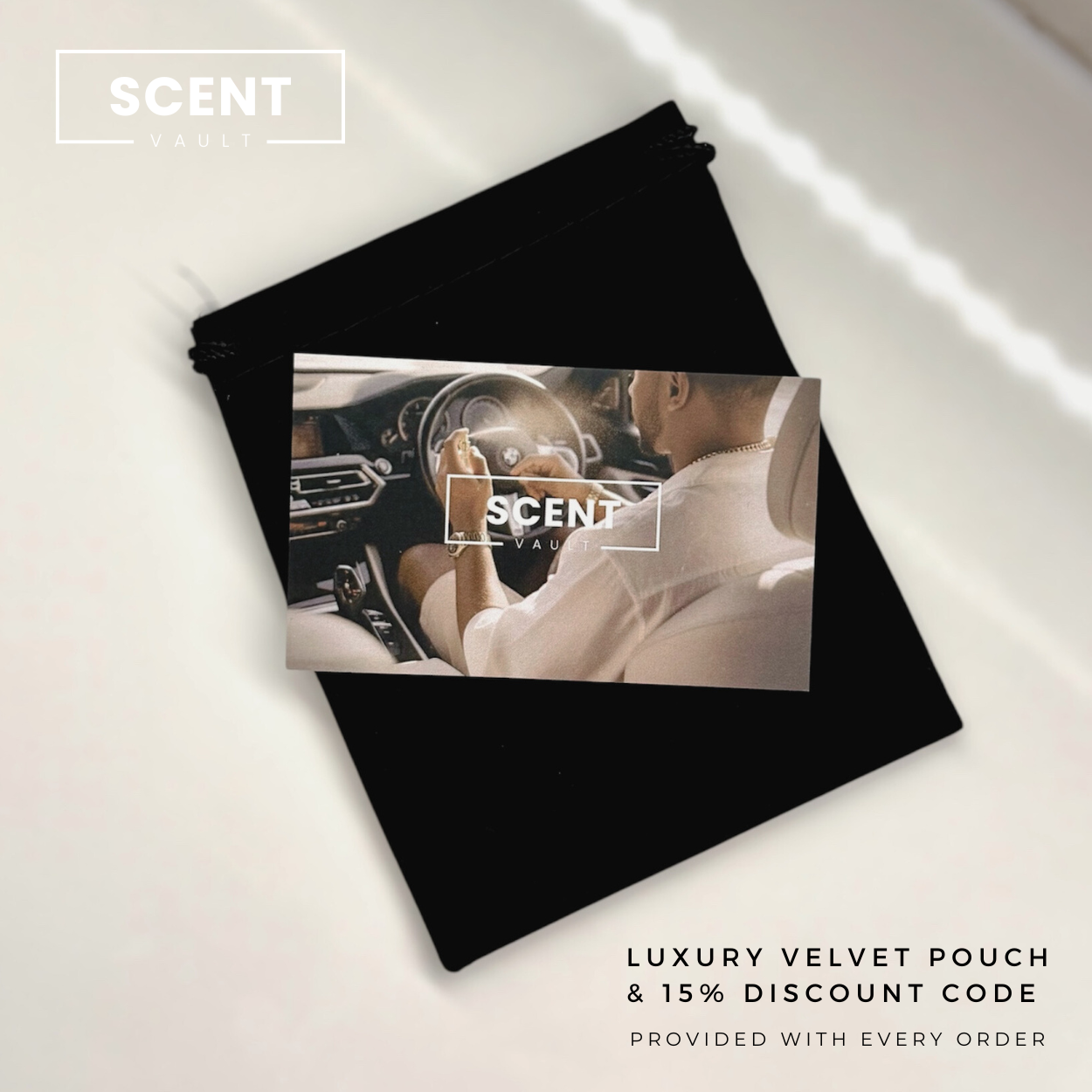 Black velvet pouch with a couple in a car on a white background, featuring the brand 'SCENT VAULT'.