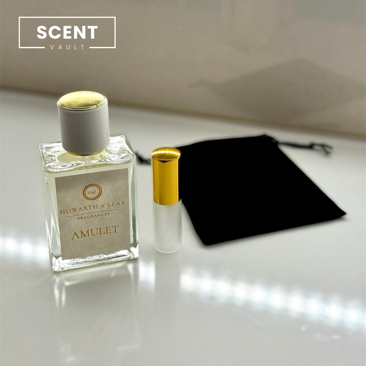 Two perfume bottles with gold caps on a light surface, featuring the 'Scent Vault' brand.