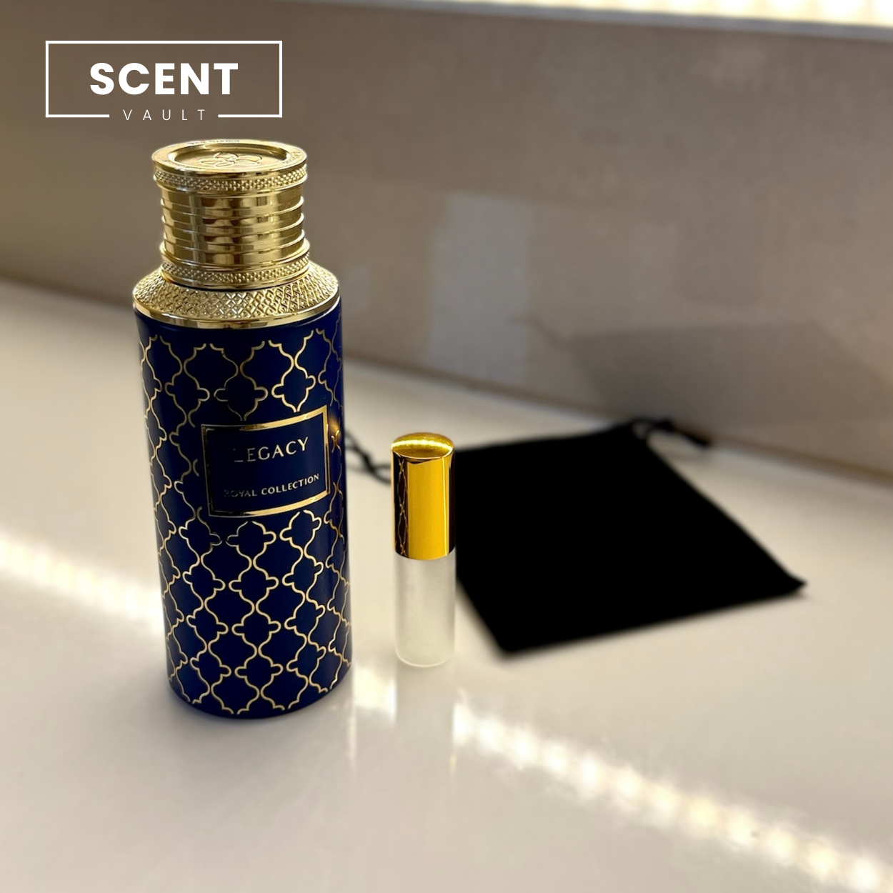 Perfume bottle with gold cap and blue label on a white surface, branded 'Scent Vault'.