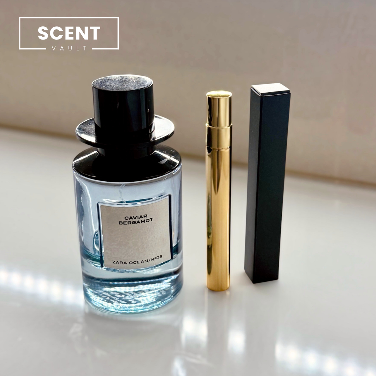 Zara x Jo Malone Caviar Bergamot 10ml gold decant atomiser and black gift box beside the full bottle - Scent Vault